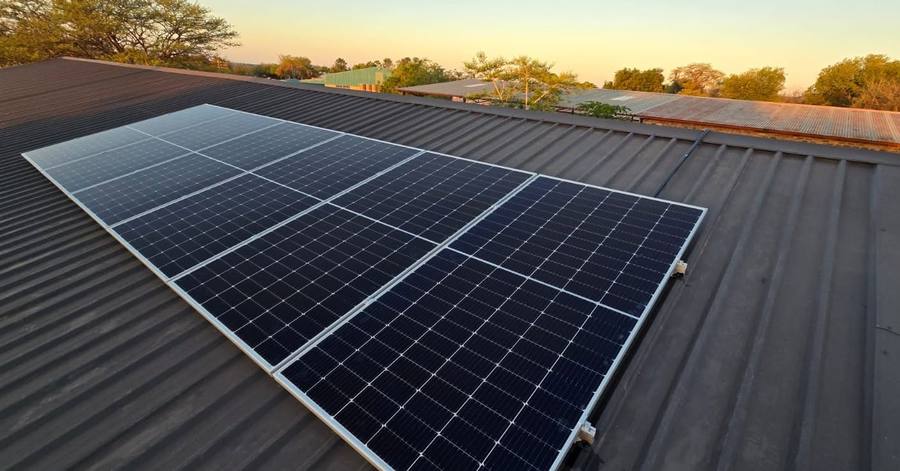 Panel array on a metal roof in evening light