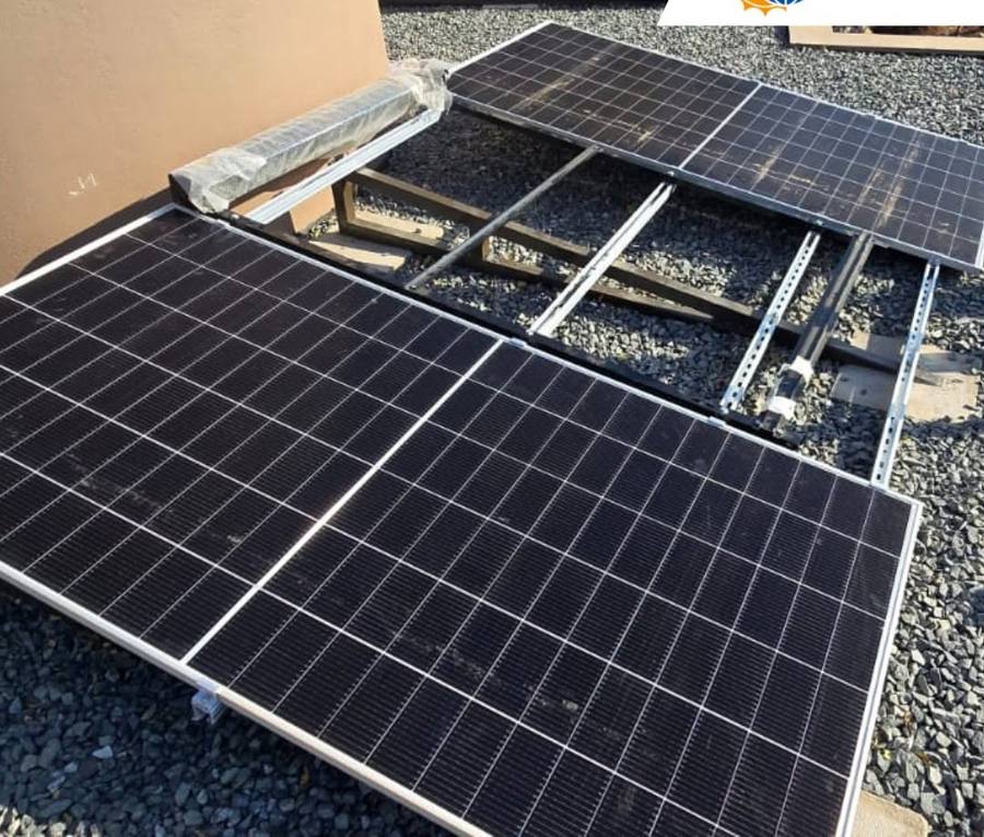 Panel on a mounting frame over gravel