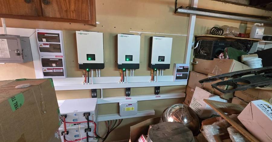 Row of inverters mounted on a wall