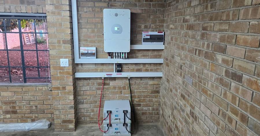 Inverter and battery on a brick wall