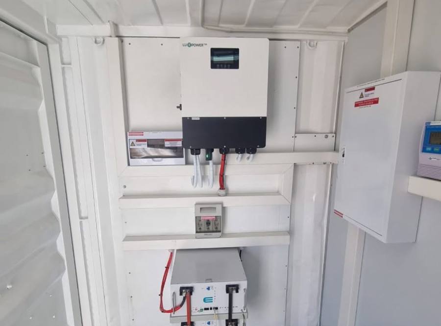Inverter and battery in a white equipment cabinet